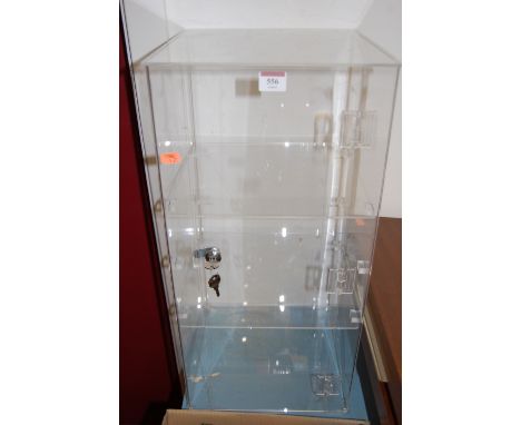 A modern perspex table-top display cabinet    Condition Report / Extra Information  One shelf missing.Width 30cm, depth 30cm,