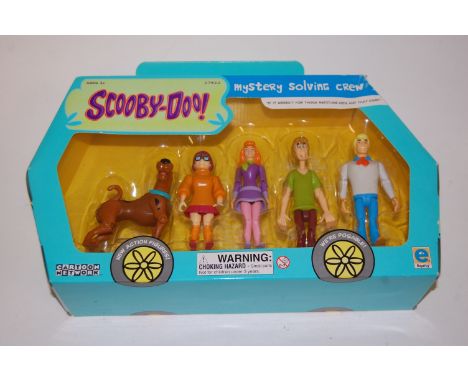A boxed Pelham type SS Cowgirl puppet; together with a boxed set of Scooby Doo Mystery Solving Crew action figures 