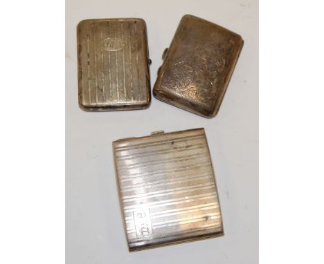 An engine turned silver pocket cigarette case and two others, gross weight 9.6oz (3)