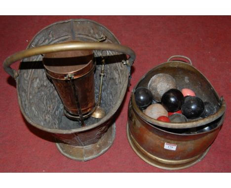 An early 20th century brass coal scuttle; together with one other; various carpet bowls etc 