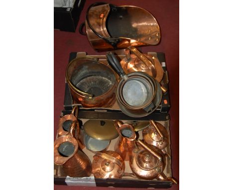 A large collection of 19th century and later copperware to include; helmet shaped coal scuttle, watering can, graduated pans 