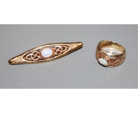 An opal and 9ct two-colour gold Celtic design brooch and ring en suite, ring size M, gross 11.2 grams.