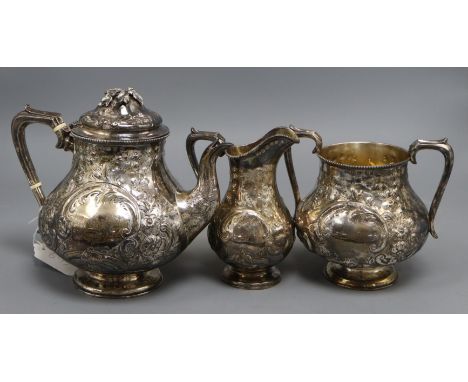 A Victorian embossed silver pear shaped three piece tea set, William Gough, Birmingham, 1863, gross 34.5 oz.CONDITION: Teapot