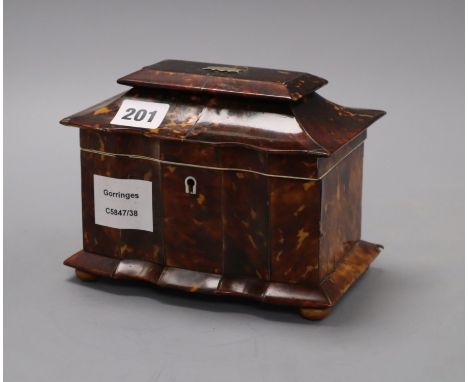 A Georgian tortoiseshell tea caddy, height 13cmCONDITION: The lid has detached from the back hinged panel, which has also det
