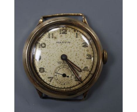 A gentleman's 9ct gold Marvin manual wind wrist watch, no strap.CONDITION: Gross weight 23.6 grams. Case diameter 30mm ex. cr