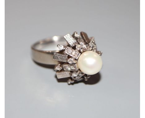 A modern 14k white metal, cultured pearl and diamond cluster dress ring, size L, gross weight 6.9 grams.CONDITION: A few of t
