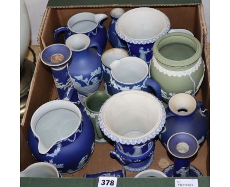 A collection of 19th and 20th century Wedgwood dark blue and green ground Jasperware, including graduated jugs, candlesticks,