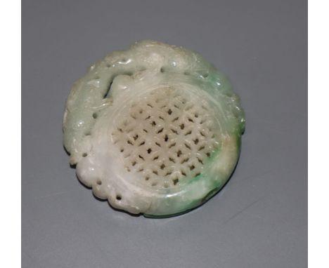 A carved jade plaque, diameter 5cm