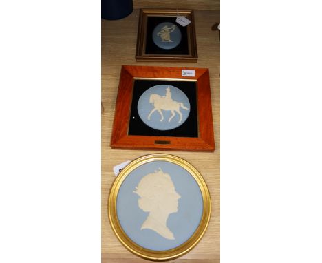 Three Wedgwood blue and white Jasperware framed plaques, comprising a circular portrait celebrating the 60th birthday of HM Q