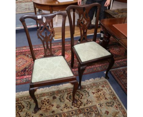 A set of four Chippendale style dining chairs