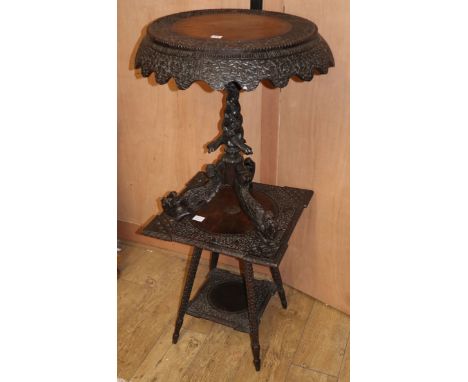 A 19th century Indian carved wood tripod table, Diam.64cm H.70cm and a similar square top two tier table