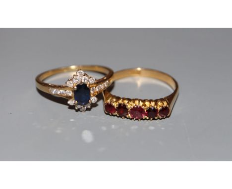 A modern 18ct gold, sapphire and diamond cluster ring and an 18ct and five stone ring, sizes Q/R &amp; R/S, gross 6.8 grams.C
