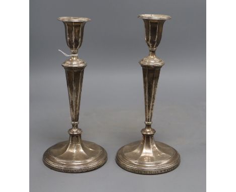 A pair of Edwardian silver candlesticks, James Deakin &amp; Sons, Sheffield, 1907, 24.7cm, weighted.CONDITION: Engraved inscr