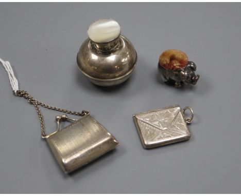 A miniature 925 purse. a silver pig pin cushion, marks rubbed, a 925 envelope stamp case and an Edwardian scent flask, 35mm.C