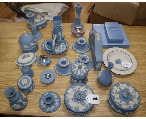 A collection of Wedgwood Jasperware decorative items, including a mantel clock, various boxes and covers, a boxed photograph 