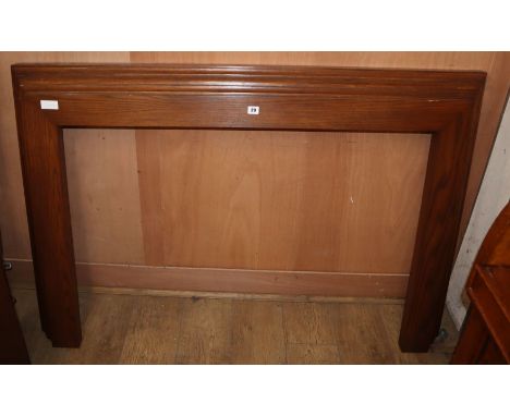 An Art Deco style oak fire surround, W.145cm H.96cm