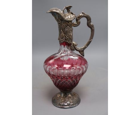 A modern silver mounted ruby flash cut glass claret jug, Da-mar Silverware, London, 1976, 32cm.CONDITION: Somewhat tarnished,