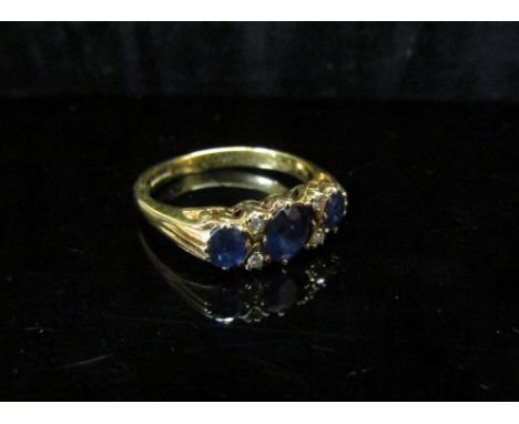 An 18ct gold sapphire and diamond ring. Size L, 3g 