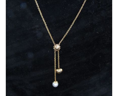 A gold necklace hung with a single pearl and sweetheart drop, stamped 585, 46cm long, 3.3g 