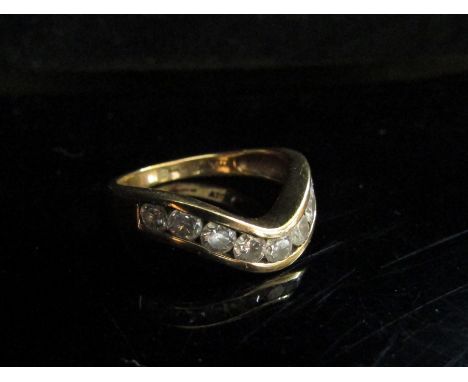 A 9ct gold diamond set wishbone ring. Size O, 3.2g 