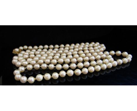 A single strand cultured pearl necklace with gold clasp stamped JKa 9ct, 100cm long 