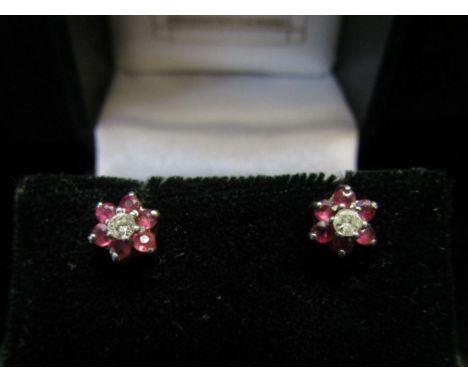 A pair of 9ct gold ruby and diamond daisy earrings, 1.3g 