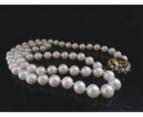 A single strand pearl necklace, 5mm pearls, 46cm long with a 9ct gold pearl and citrine set clasp 