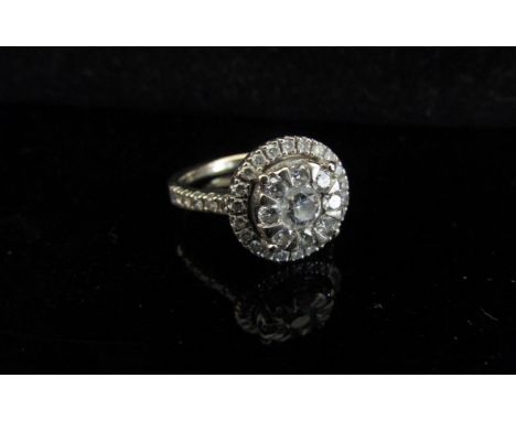 An 18ct white gold cluster ring, 1ct total. Size N, 4.3g with original receipt 