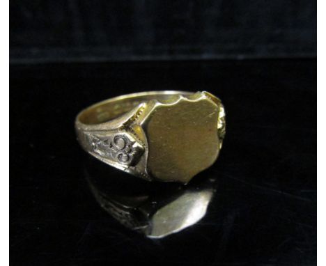 An 18ct gold signet ring, vacant shield shape front, engraved shoulders. Size Z3, 9.5g 