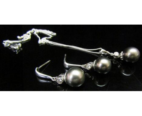 An 18ct white gold fine neckchain, 45cm long, hung with a diamond and grey pearl drop with a pair of matching earrings (9mm p