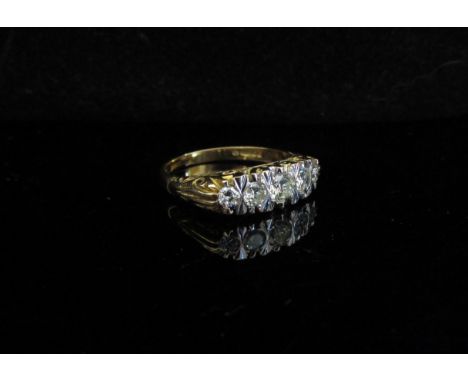 An 18ct gold five stone diamond ring. Size Q, 5.5g 