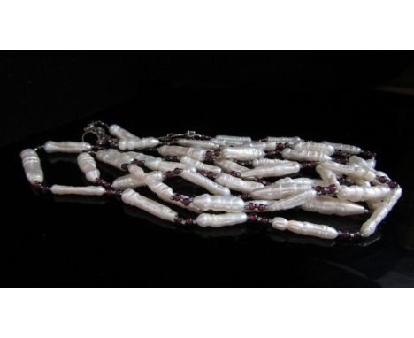 A three strand fresh water pearl and ruby bead necklace 