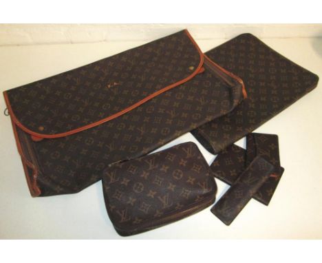 LOUIS VUITTON TRAVEL ACCESSORIES, to include a travel kit with card holder, comb holder, passport holder, a garment carrier a