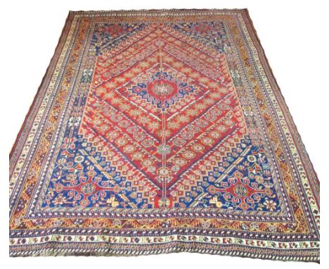 VERY FINE ANTIQUE PERSIAN QASHQAI CARPET, 285cm x 200cm, Mina Hani design in shades of ruby and sapphire within multiple bord