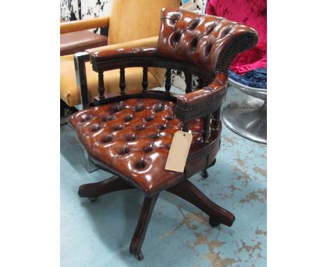 REVOLVING DESK CHAIR, tan brown leather upholstered with deep button back revolving and reclining on an adjustable base with 