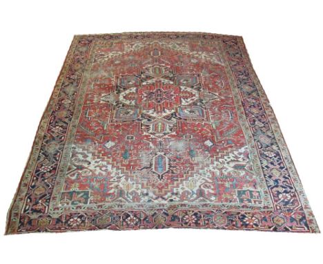 FINE VINTAGE PERSIAN HERIZ CARPET, 318cm x 248cm, central medallion issuing palmettes on terracotta field.