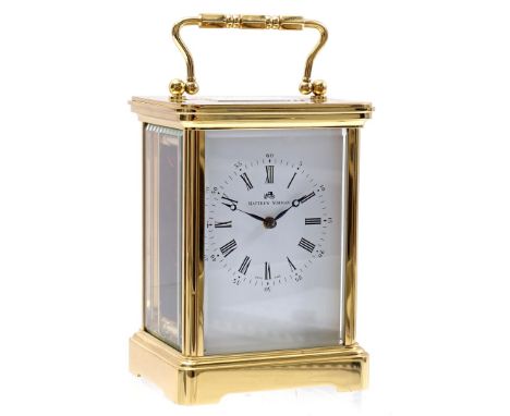 Brass travel alarm clock, marked on the dial Matthew Norman, on the back of the movement Eleven jewels unadjusted Swiss made 