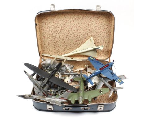 Suitcase with plastic scale model aircraft