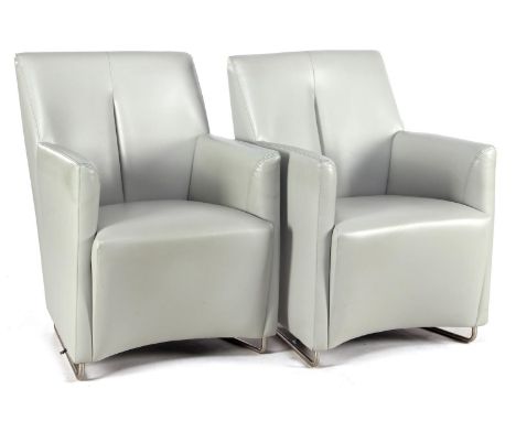 2 Leolux gray leather armchairs on stainless steel sled base