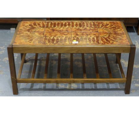 A mid 20th century Scandinavian centre table with tiled top and laddered under shelf, 88x47x40cm H. Not available for in-hous