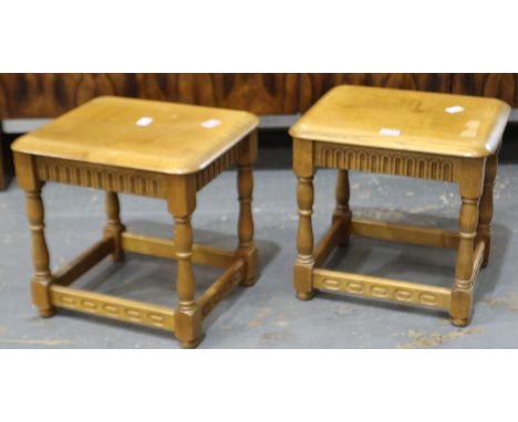 Pair of golden oak lamp tables in the Ercol manner, 45x39x43cm H. Loss of varnish to one top. Not available for in-house P&am