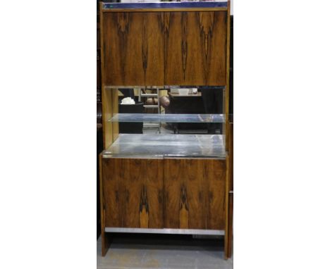 Richard Young for Merrow Associates rosewood drinks cabinet having four cupboard doors, two internal drawers and glass shelve