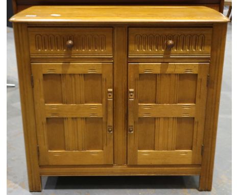 An elm sideboard of two drawers and two cupboard doors in the Ercol manner, 90x42x82cm H. Not available for in-house P&amp;P 