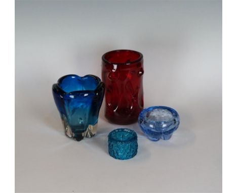 Four pieces of Whitefriars glassware, to include a knobbly vase in a ruby colourway, a molar vase in kingfisher blue colourwa