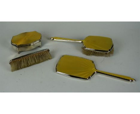 A George V and later hallmarked silver and yellow enamelled four piece dressing table set comprising hand mirror, hairbrush, 