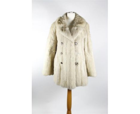 A circa 1970's cream/silver mink jacket, long hip length with double self lined collar, three pairs of feature buttons to fas