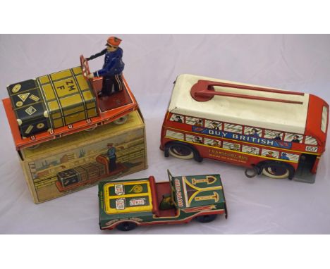 A Wells Brimtoy large tinplate trolley bus - red with white roof, detailed tin printed including passengers with trolley pole