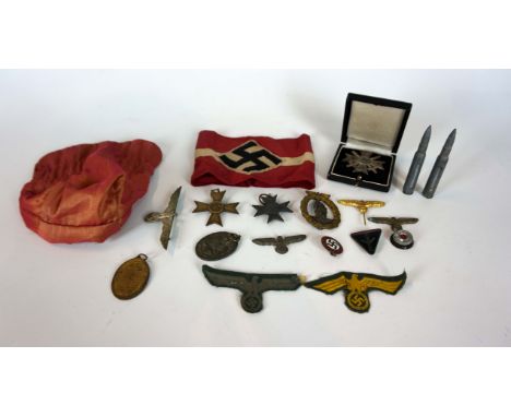 A collection of Nazi war memorabilia to include Nazi Navy minesweeper badge, war merit cross, armband, cased war merit cross 