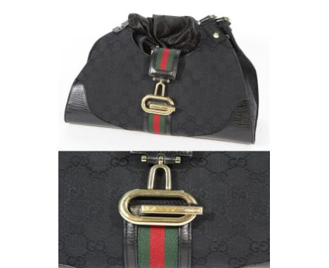 Gucci: an embossed black canvas and leather messenger bag, with signature green and red webbing to stylised gold tone G-form 