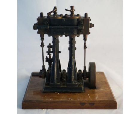 A stationary live steam engine by W Stevens's model dock yard Aldgate London on wooden base, height 15cm  CONDITION REPORT: 7